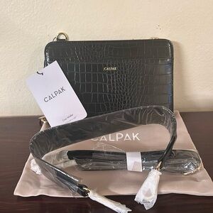 NWT- CalPak Croc Travel Wallet, Black. New, never opened or used.